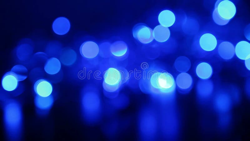 Defocused blue lights with bokeh, blurred motion abstract backgrounds
