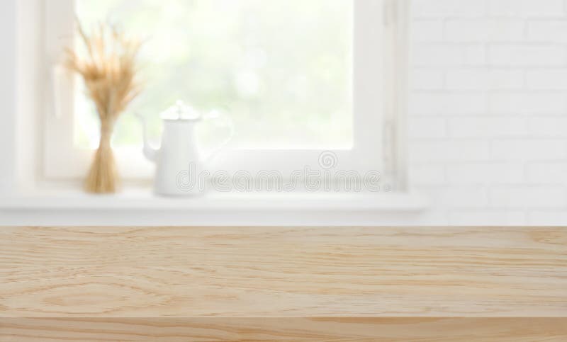 Defocused kitchen window sill background over wooden texture board