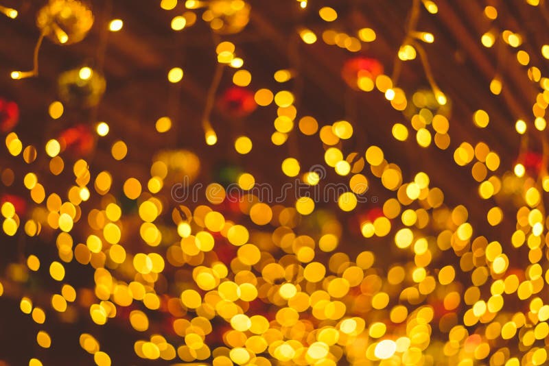 Defocused Ligths Of Christmas Ornaments Hanging From Ceiling