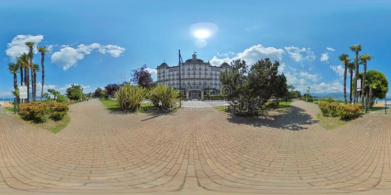 Equirectangular Panoramic 360 Degrees Panoramic View of Corso Umberto I sidewalk in front of the Grand Hotel des Iles Borromees by day at Lago Maggiore in Stresa, Piedmont, Italy - May 30, 2020. Equirectangular Panoramic 360 Degrees Panoramic View of Corso Umberto I sidewalk in front of the Grand Hotel des Iles Borromees by day at Lago Maggiore in Stresa, Piedmont, Italy - May 30, 2020
