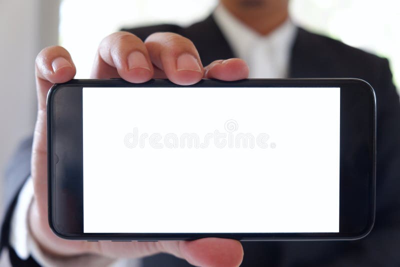 Del hombre de negocios de la tenencia del smartphone pantalla blanca vacía adelante para su texto o imagen imágenes de archivo libres de regalías Del hombre de negocios de la tenencia del smartphone pantalla blanca vacía adelante para su texto o imagen imágenes de archivo libres de regalías