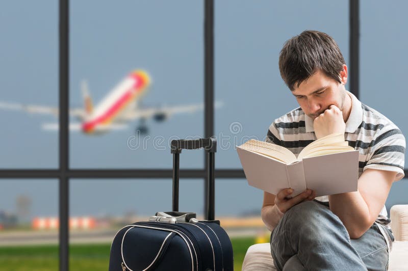 Delayed aeroplane concept. Man is sitting with baggage in airport