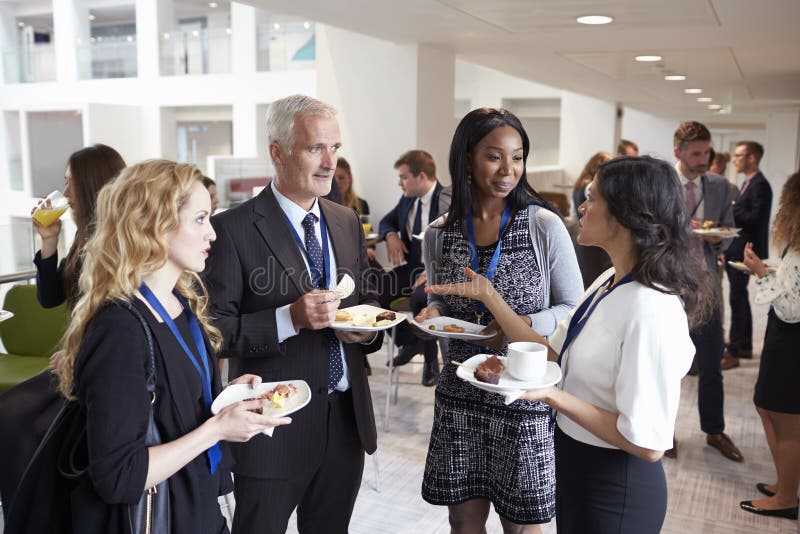 Delegates Networking during Conference Lunch Break Stock Image - Image