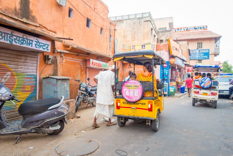 DELHI, INDIA - SEPTEMBER 19, 2017: Autorickshaw Yellow and Green in the