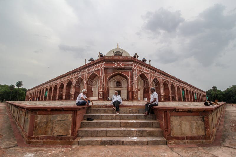 Delhi, New Delhi/ India- May 30 2020: Three old aged people sitting in the compound of Humayun's Tomb having a conversation, royalty free stock photos Delhi, New Delhi/ India- May 30 2020: Three old aged people sitting in the compound of Humayun's Tomb having a conversation, royalty free stock photos