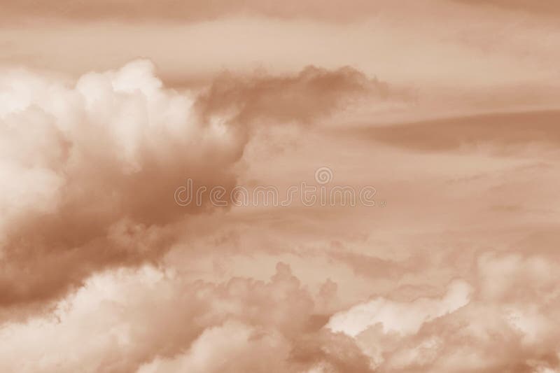 A delicate cloudscape in Peach Fuzz royalty free stock photo