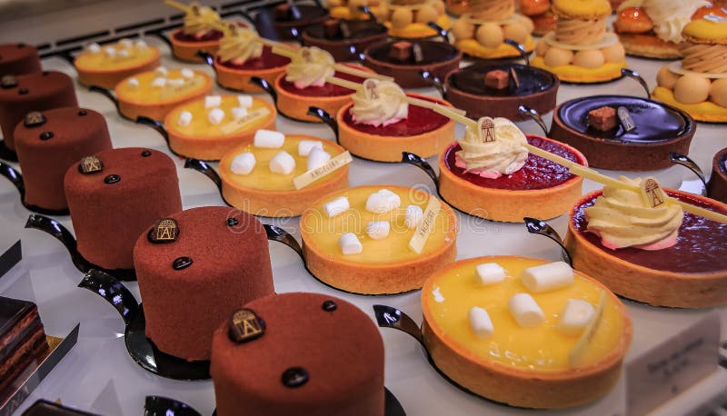 Paris, France - January 21, 2015: Delicate petit fours desserts at the famous tea house Angelina on Rue de Rivoli in Paris. Paris, France - January 21, 2015: Delicate petit fours desserts at the famous tea house Angelina on Rue de Rivoli in Paris