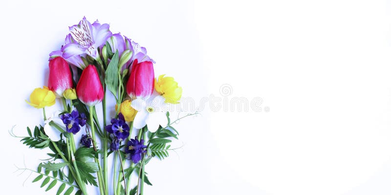 Delicate spring flower arrangement. Crimson tulips, white daffodils and lilac Alstroemeria flowers on a white background. stock photo Delicate spring flower arrangement. Crimson tulips, white daffodils and lilac Alstroemeria flowers on a white background. stock photo