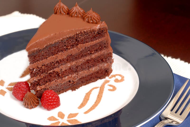 Delicious 4 layer chocolate cake with raspberries