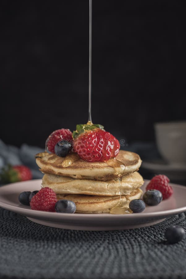 Delicious American Pancakes with Berries and Syrup. Vertical. Closeup ...