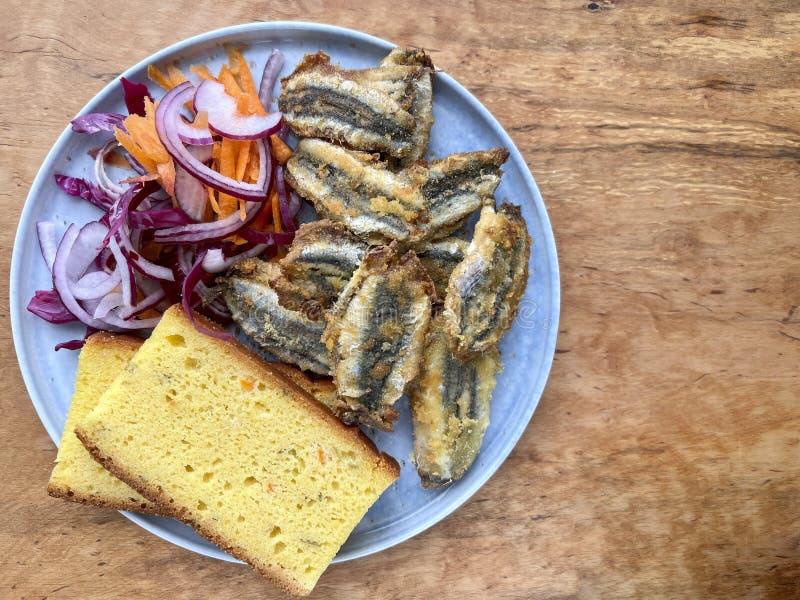 Delicious Anchovy Fish Fry and Corn Bread on Table Stock Photo Image