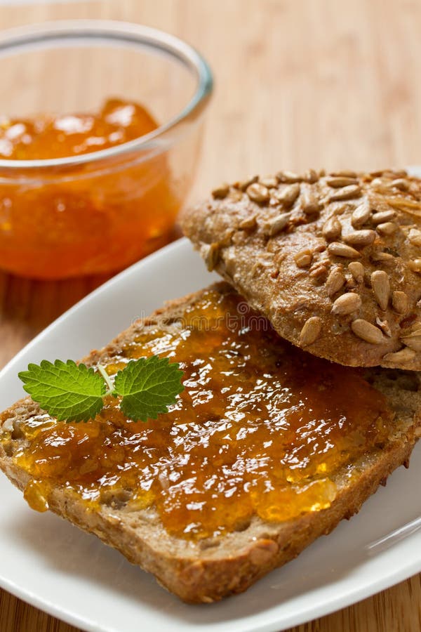 Delicious Apricot Jam on a Slice of Bread with Butter Stock Image