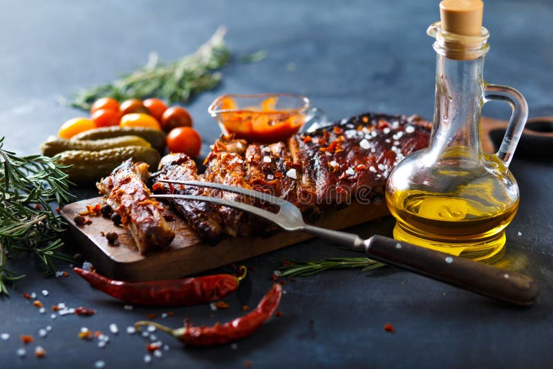 Delicious barbecued ribs seasoned with a spicy basting sauce and served with chopped stock images Delicious barbecued ribs seasoned with a spicy basting sauce and served with chopped stock images