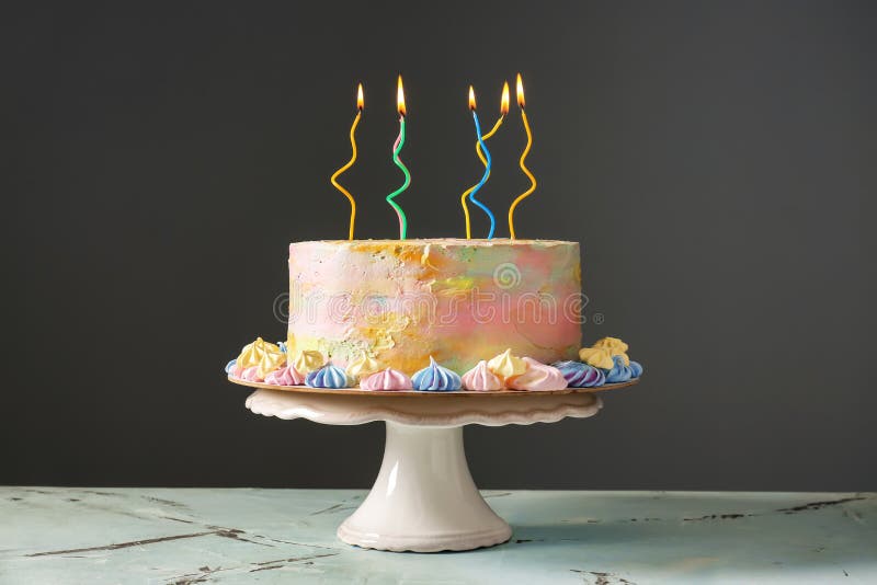 Delicious Birthday Cake with Burning Candles on Table Stock Image