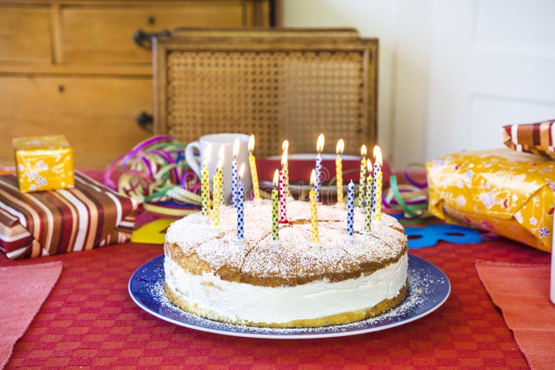 Delicious birthday cupcake on table