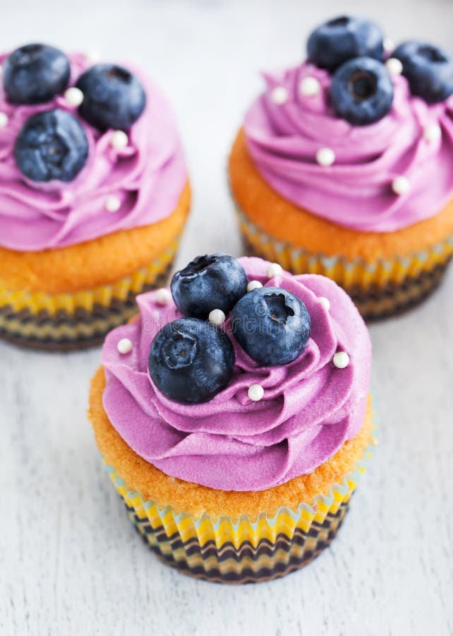 Delicious Blueberry Cupcakes Stock Photo - Image of icing, muffin: 54957626