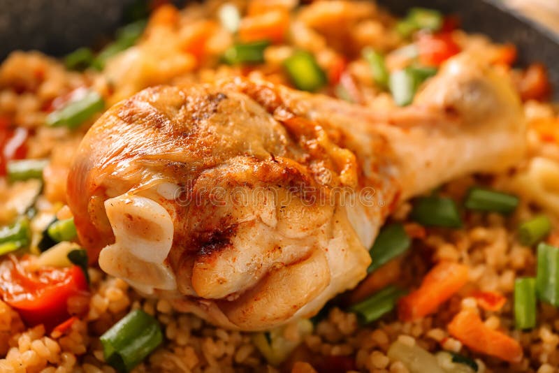Delicious Boiled Rice with Chicken Leg and Vegetables, Closeup Stock