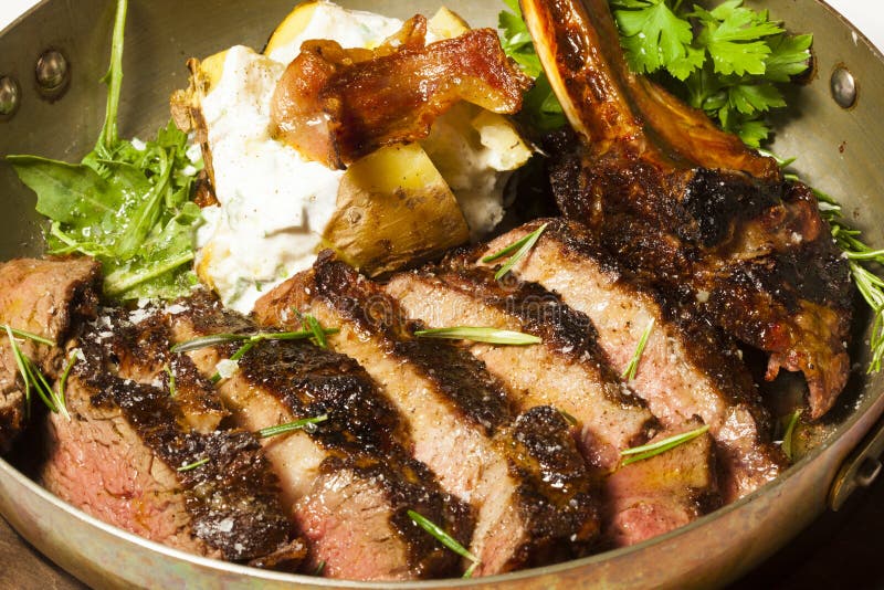 Delicious Bone in Rib Eye Steak Served in Steel Pan Stock Photo Image