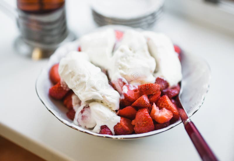 Delicious bowl of strawberry with ice cream. stock photography