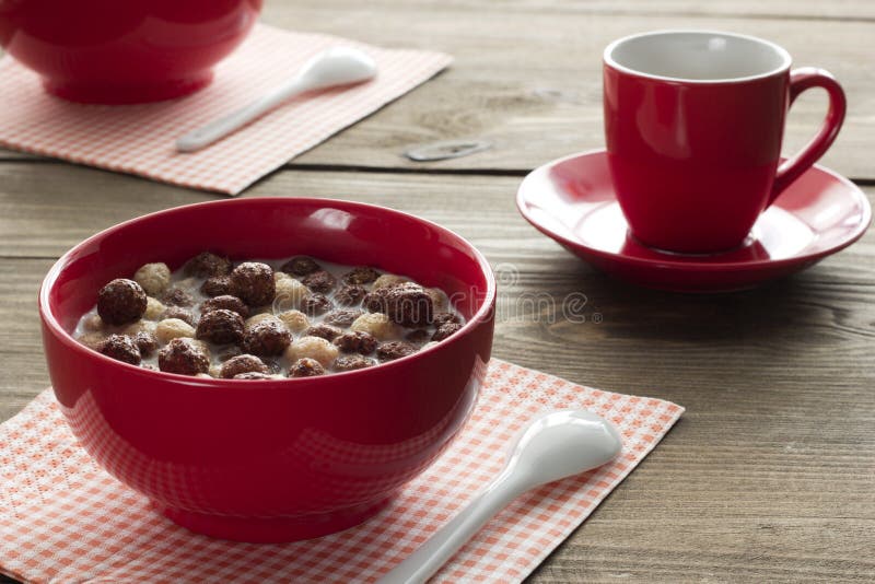 Delicious breakfast of chocolate cereal balls and coffee in a cu stock photography