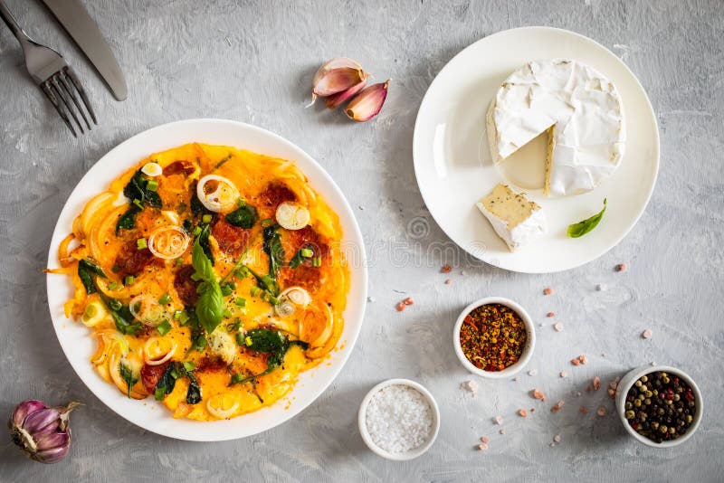 Delicious Breakfast Scrambled Eggs with Onion and Chorizo on Gray