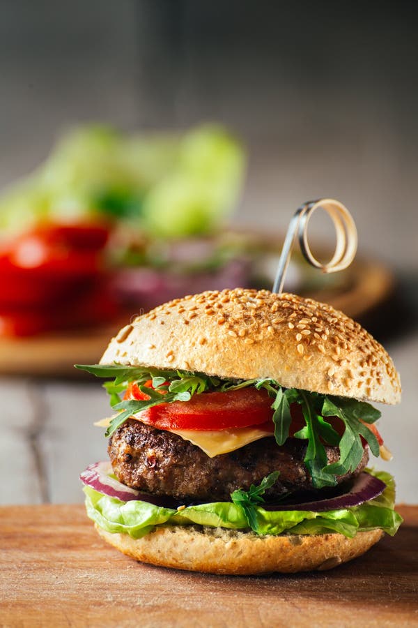 Delicious Burgers with Beef, Tomato, Cheese and Lettuce Stock Image ...