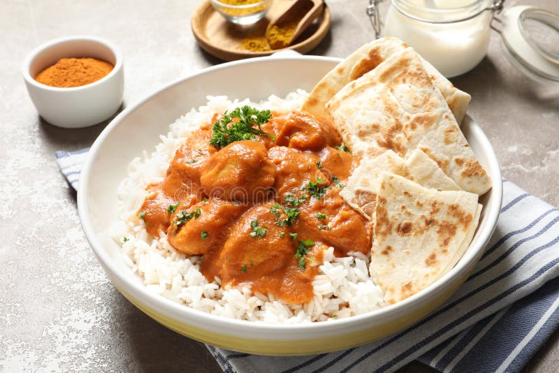 Delicious butter chicken with rice in plate