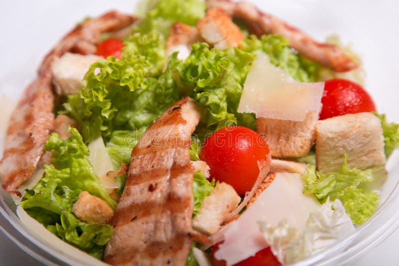 Delicious Caesar salad with chicken meat