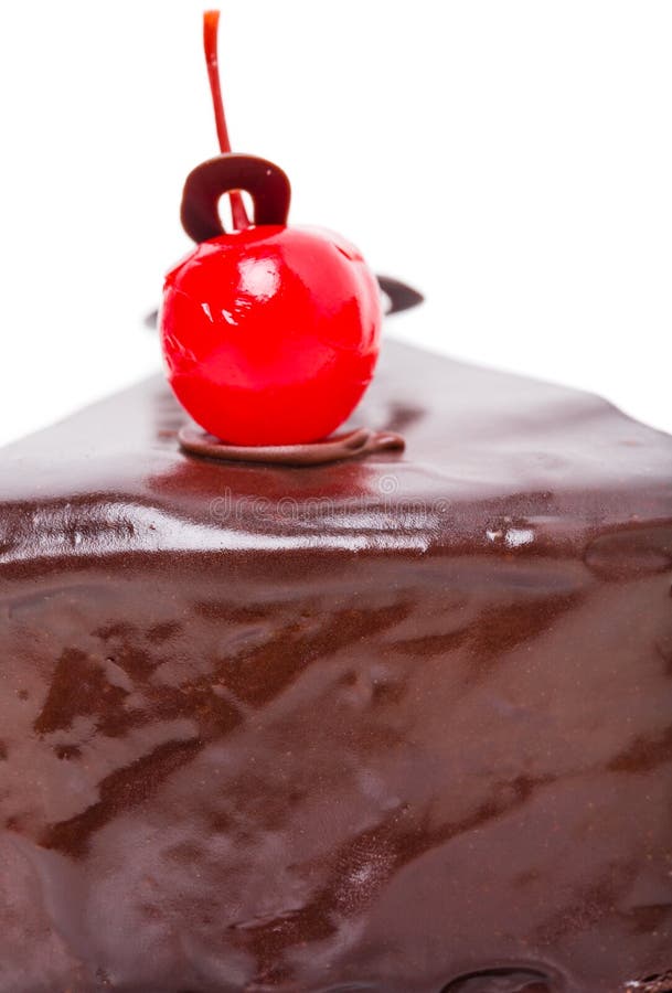 Delicious chocolate cake with cocktail cherry.