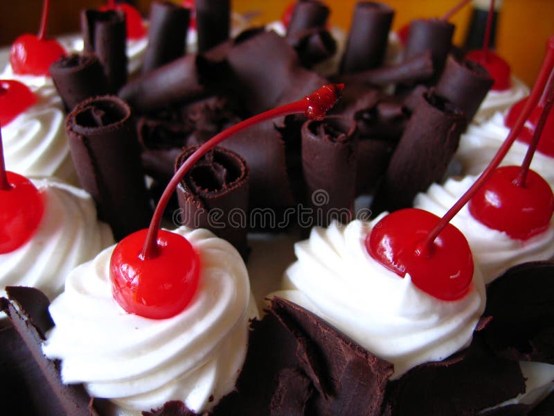 Delicious chocolate cake with maraschino cherries