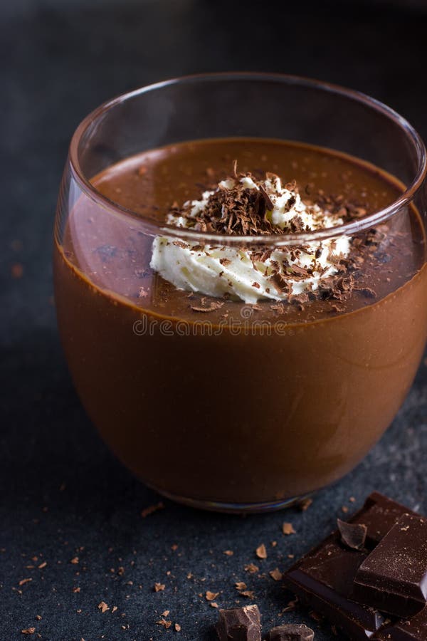 Delicious Chocolate Pudding with Whipped Cream in Glass Stock Photo