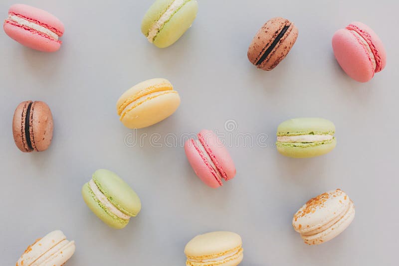 Delicious colorful macaroons on trendy pastel gray paper flat la royalty free stock image Delicious colorful macaroons on trendy pastel gray paper flat la royalty free stock image