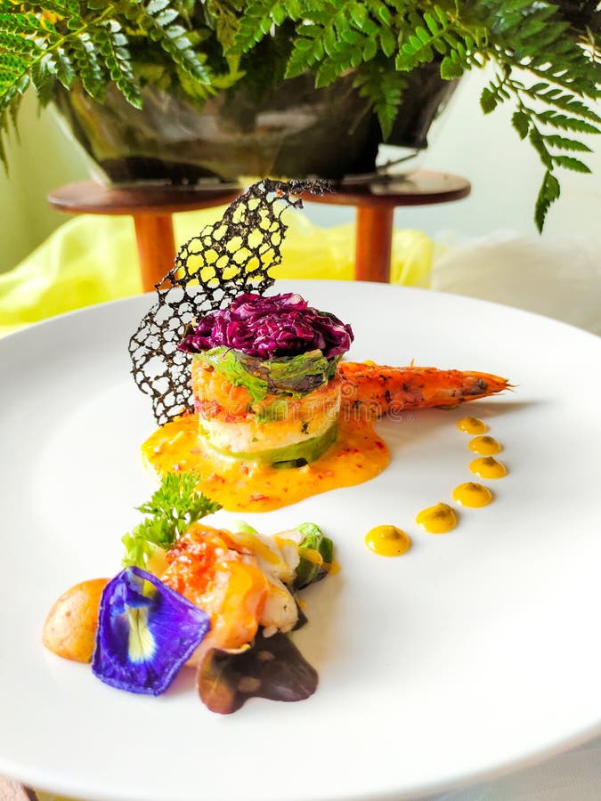 Delicious Continental Dishes Served with a Complement of Yellow Sauce