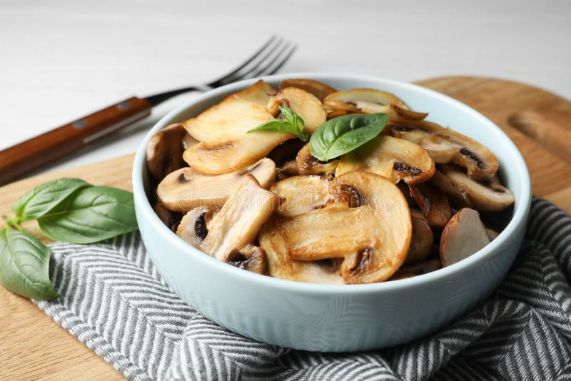 Delicious cooked mushrooms with basil served