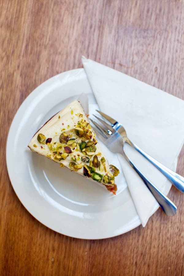 A Delicious Cream Cake Was Placed on a White Plate on the Table of a Coffee Shop in Melbourne