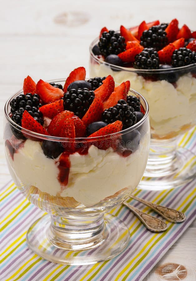 Delicious Creamy Dessert with Biscuits, Strawberries, Blackberries and