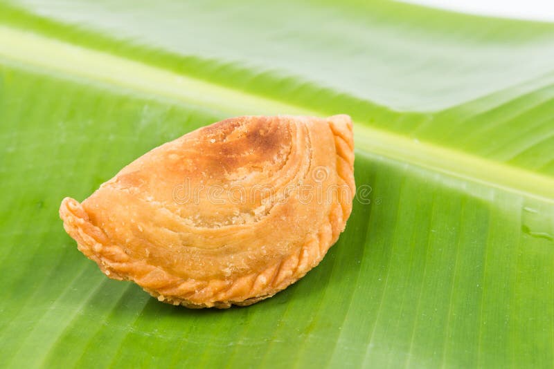 Delicious curry puffs on banana leaf royalty free stock photos