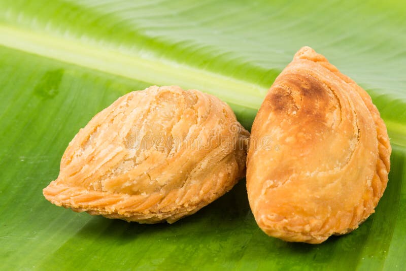 Delicious curry puffs on banana leaf stock photos