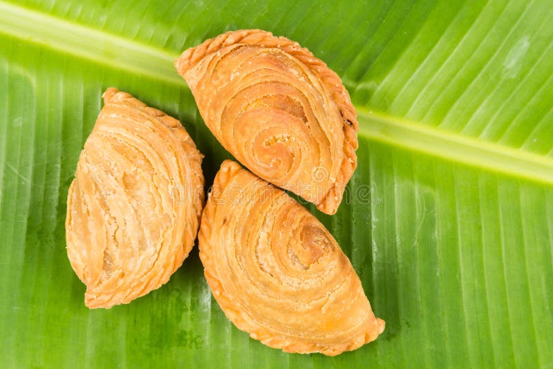 Delicious curry puffs on banana leaf royalty free stock image