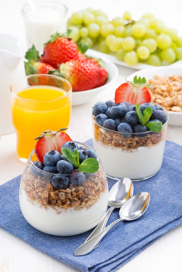 Delicious Dessert with Cream, Fresh Berries and Muesli, Vertical Stock