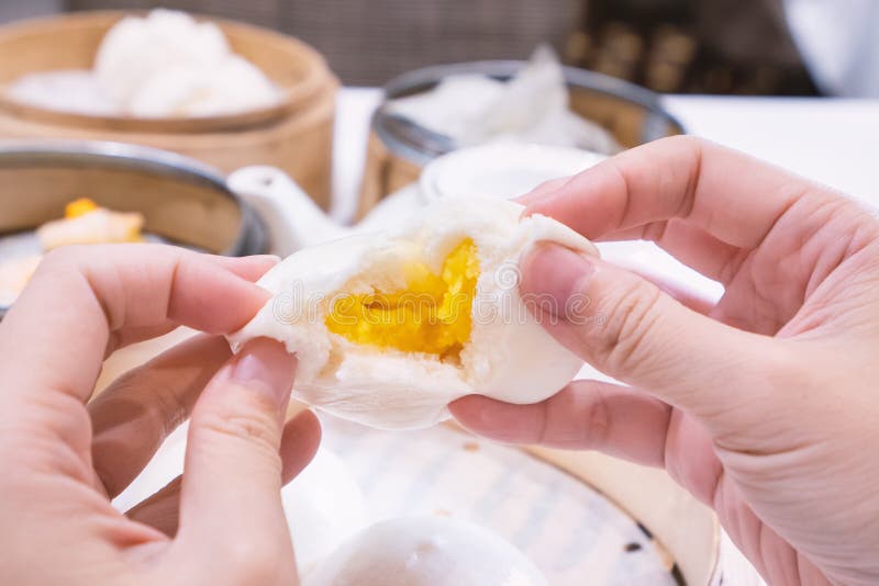 Delicious dim sum, famous cantonese food in asia, fresh and hot salted creamy custard buns in bamboo steamer in hong kong yumcha. Restaurant, close up stock photos Delicious dim sum, famous cantonese food in asia, fresh and hot salted creamy custard buns in bamboo steamer in hong kong yumcha. Restaurant, close up stock photos