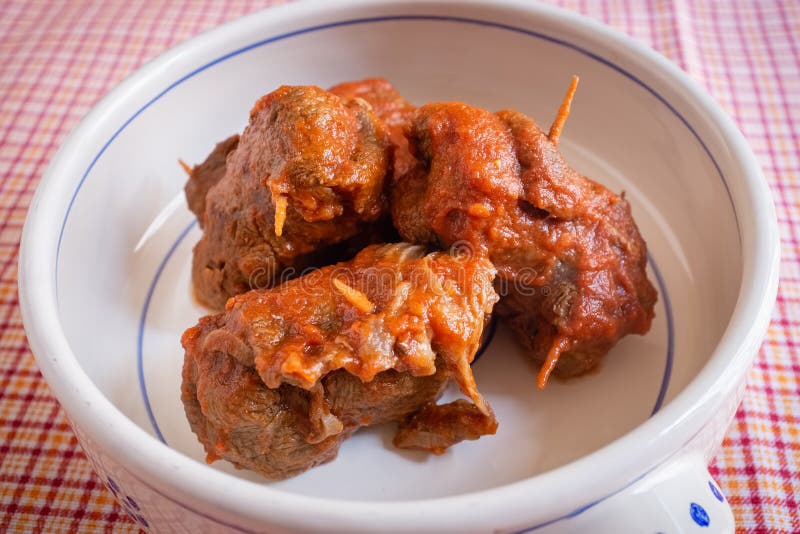 Delicious dish made of beef meat roll called braciola with tomato sauce