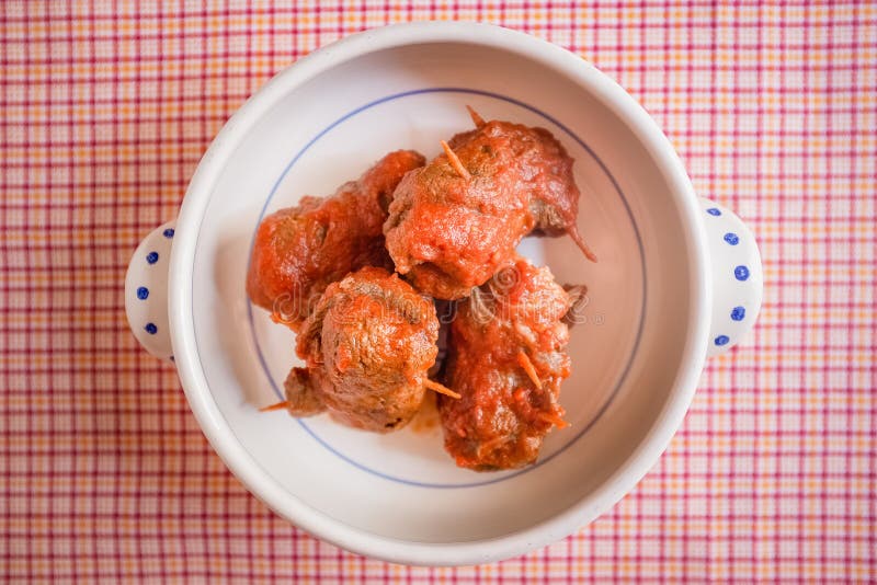 Delicious dish made of beef meat roll called braciola with tomato sauce