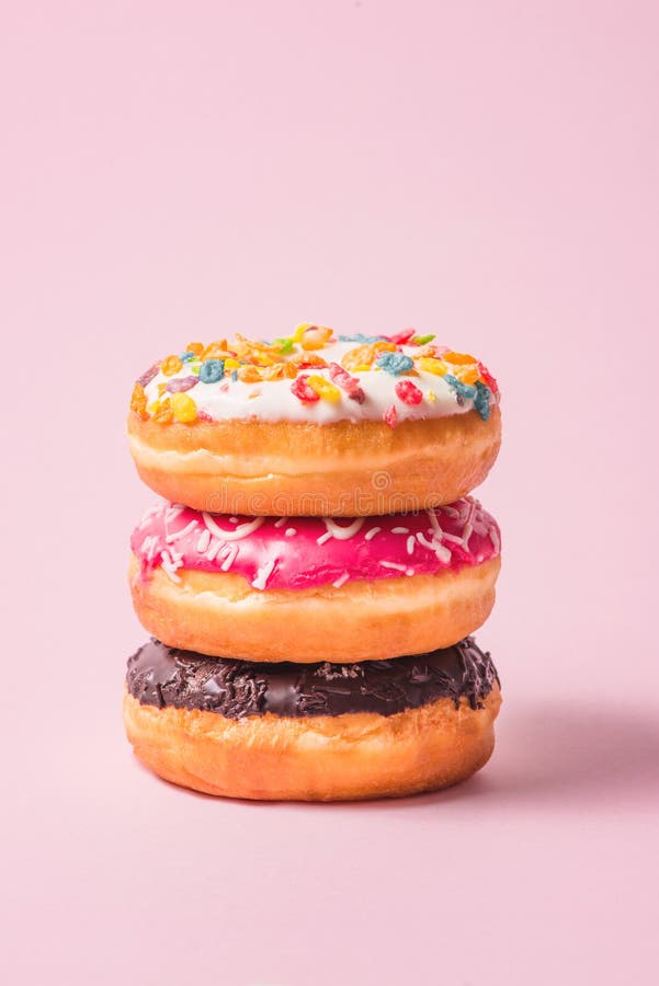 Delicious donuts for birthday on pastel pink background. royalty free stock photography Delicious donuts for birthday on pastel pink background. royalty free stock photography