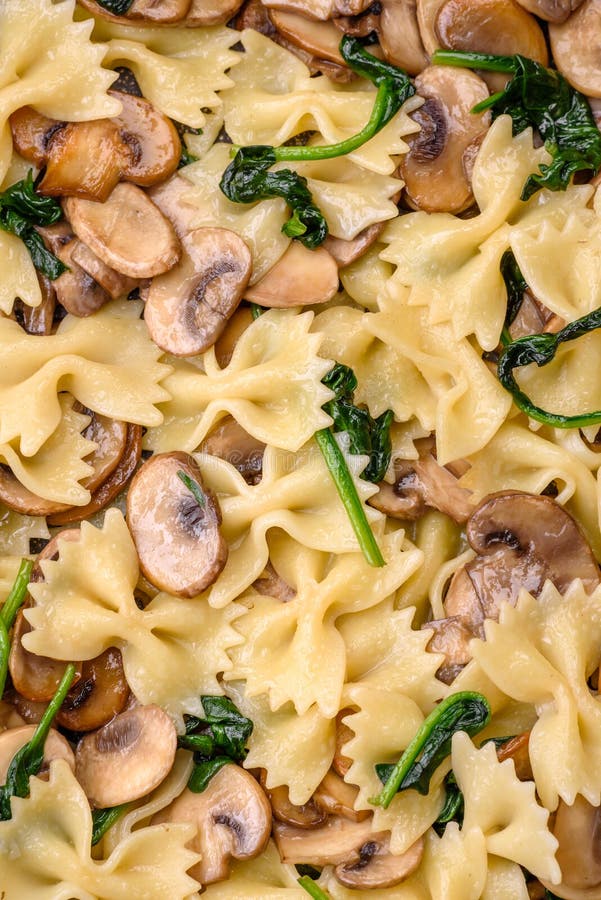 Delicious Farfalle Pasta with Mushrooms, Cheese and Spinach with Spices