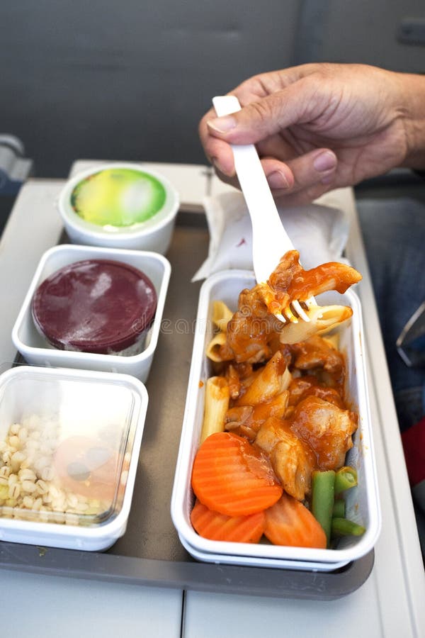 Delicious food served on board of economy class airplane on the table royalty free stock photography Delicious food served on board of economy class airplane on the table royalty free stock photography