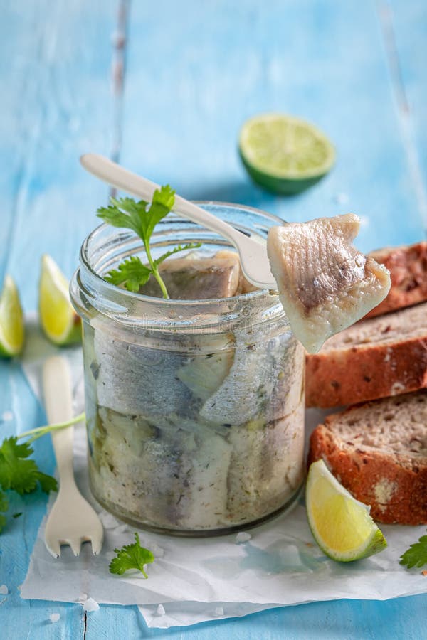 Delicious and Fresh Marinated Herring in Jar with Oil Stock Photo