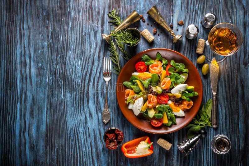 Delicious fresh seafood salad on the old wooden background stock photo Delicious fresh seafood salad on the old wooden background stock photo