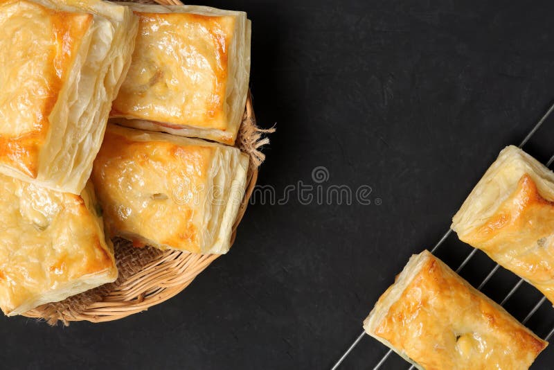 Delicious Fresh Square Butter Pie Bread in Basket on a Black Background