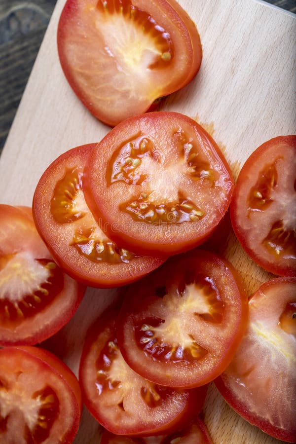 Delicious Fresh Tomato Cut into Chunks on the Table Stock Photo Image